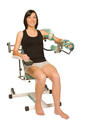 Arthromoteur coude Kinetec CEM avec chaise confort